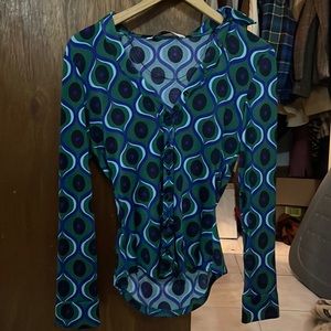 green,blue, white, and black top